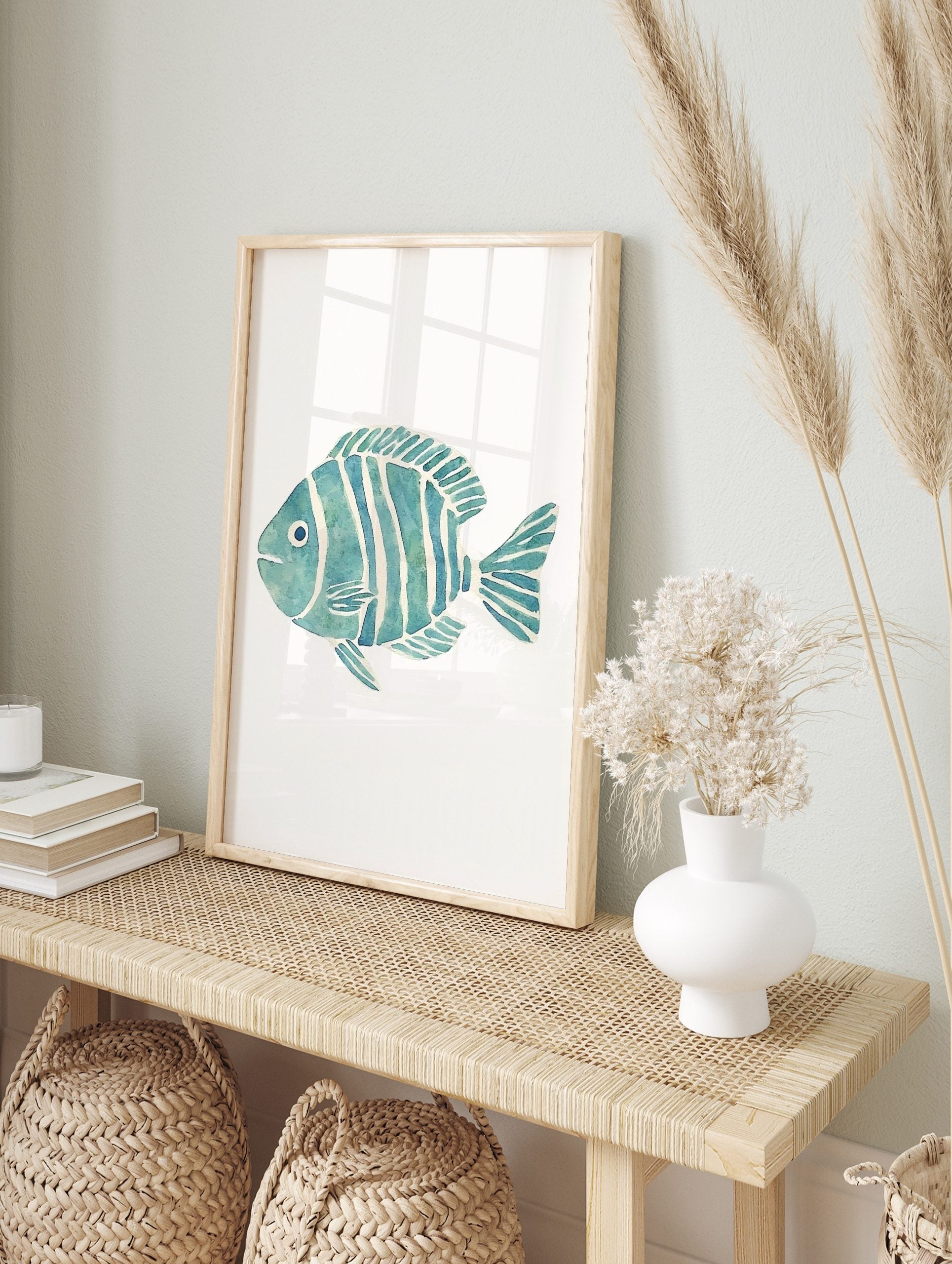 Blue and green striped fish watercolour illustration art print on a white background, facing, in an alternate framed mockup