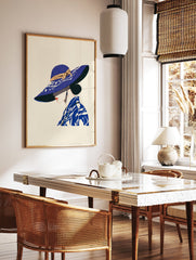 Illustrated Blue Hat Woman Wall Art print, profile view, wearing a wide-brimmed blue hat with tan ribbon and patterned blue top - Image 2