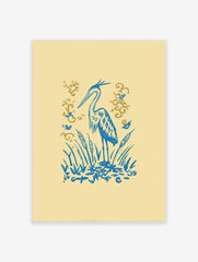 Illustrative blue heron standing amongst blue cattails and reeds with golden flourishes on a pale yellow background
