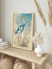 Blue heron bird wall art illustration in watercolour style, standing amidst reeds with a, in an alternate framed mockup