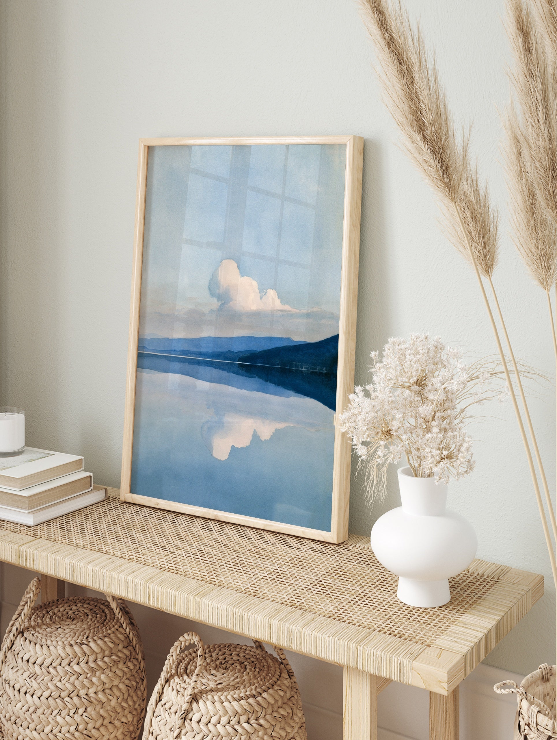 Minimalist landscape wall art featuring a mountain range reflected in a calm blue lake with a, in an alternate framed mockup