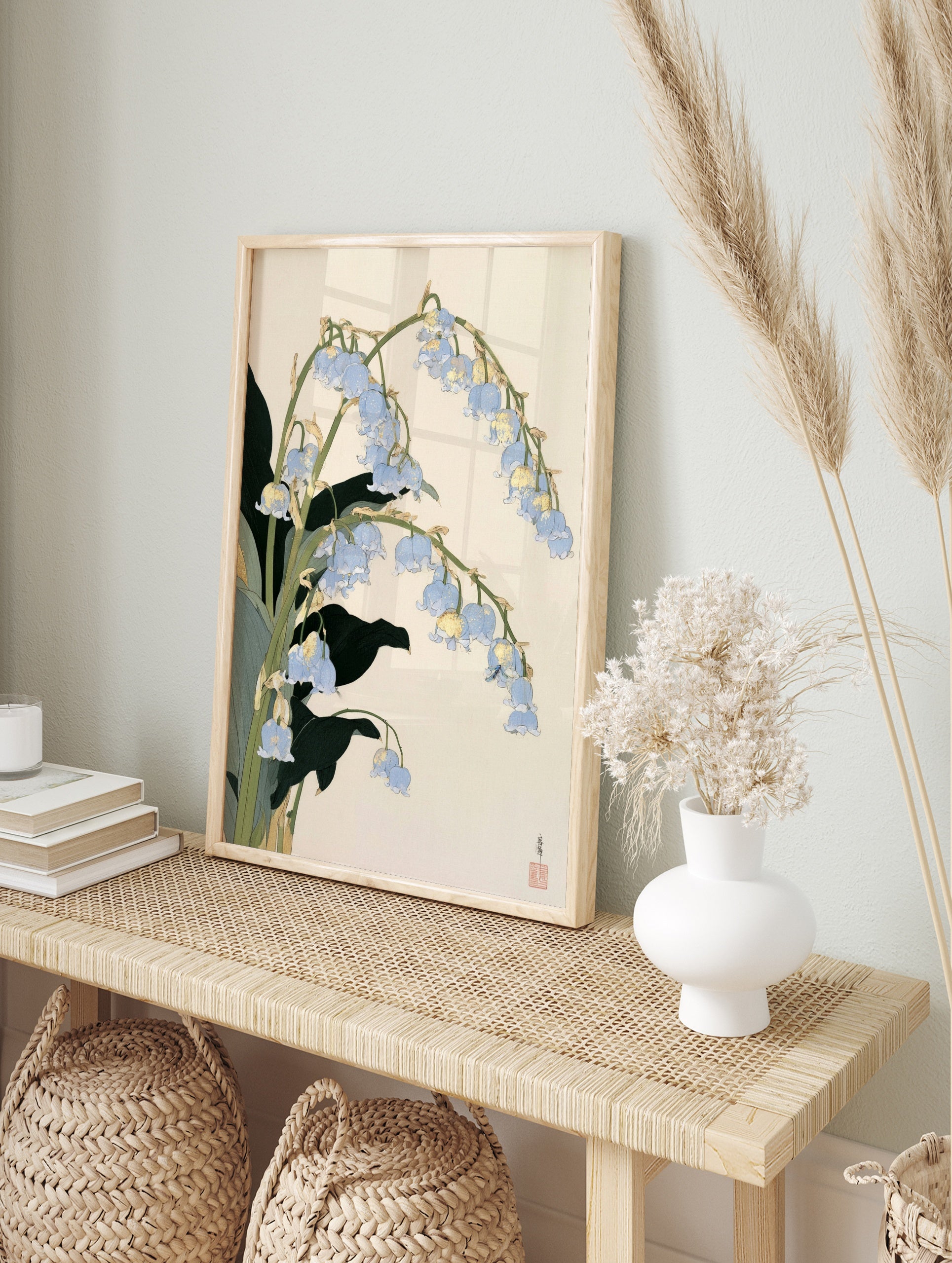 Blue lily of the valley flower botanical illustration with gold accents on a beige background, in an alternate framed mockup