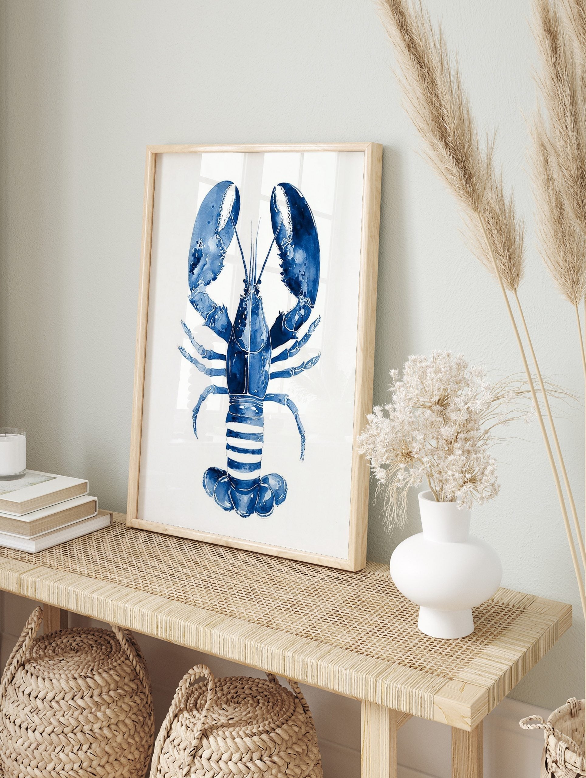 Blue lobster watercolour illustration art print on a white background, showing claws and, in an alternate framed mockup
