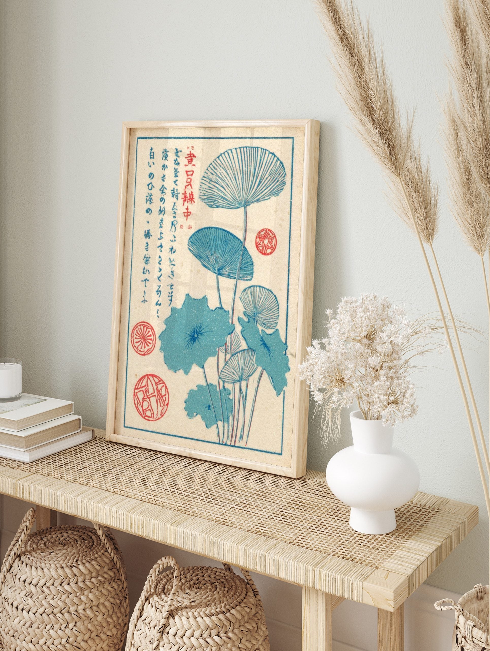 Blue lotus leaf botanical print with fan-like leaves, stems, and Japanese text on a cream, in an alternate framed mockup