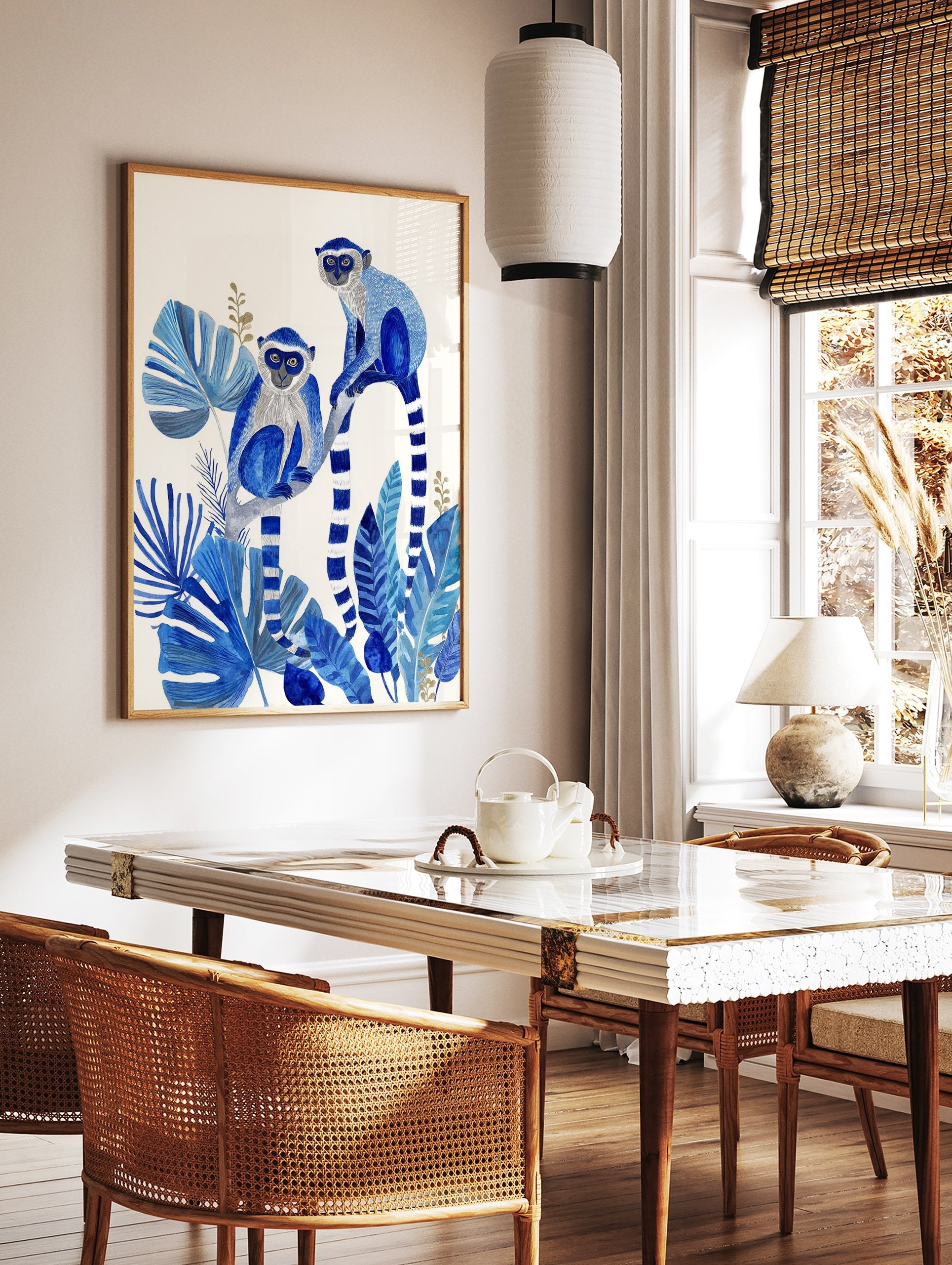 Blue monkey poster featuring two monkeys with white faces and striped tails among large blue tropical leaves and golden accents. - Image 2