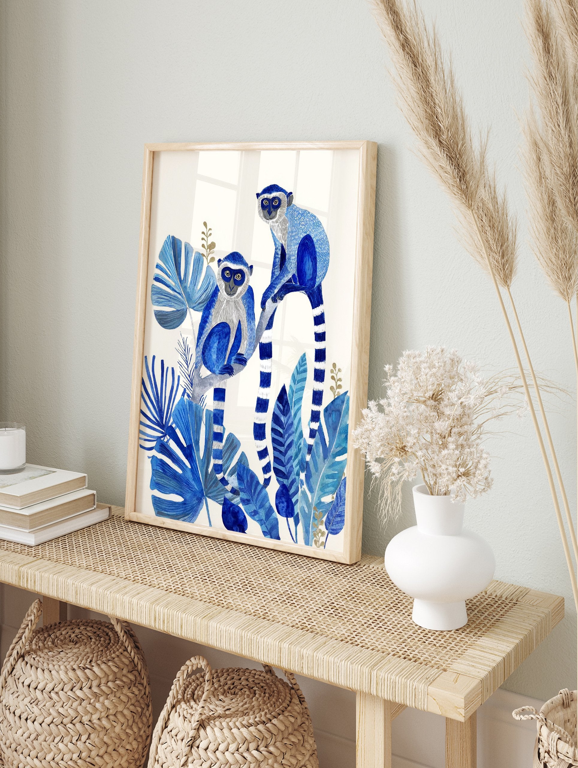 Blue monkey poster featuring two monkeys with white faces and striped tails among large blue tropical leaves and golden accents. - Image 4