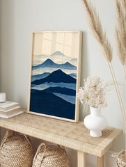 Minimalist blue mountain landscape art print with layered misty peaks in a Japanese-inspired, in an alternate framed mockup