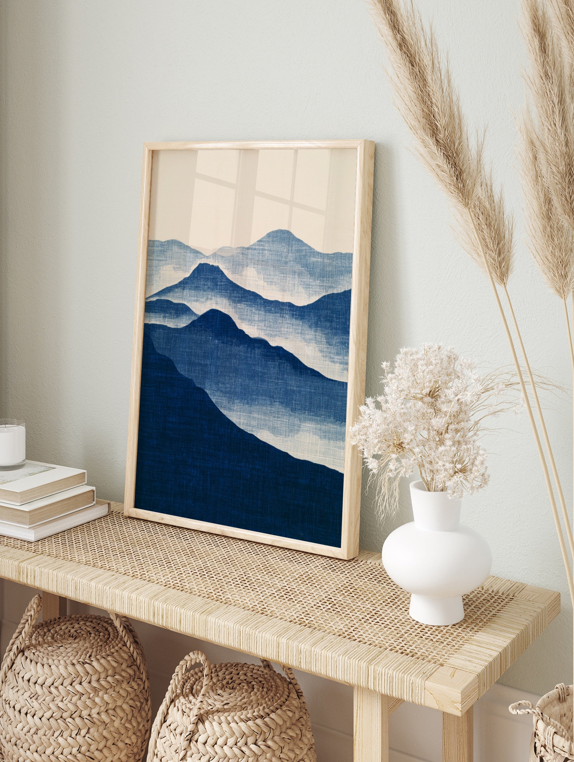 Minimalist blue mountain landscape wall art print with layered peaks and misty atmospheric, in an alternate framed mockup