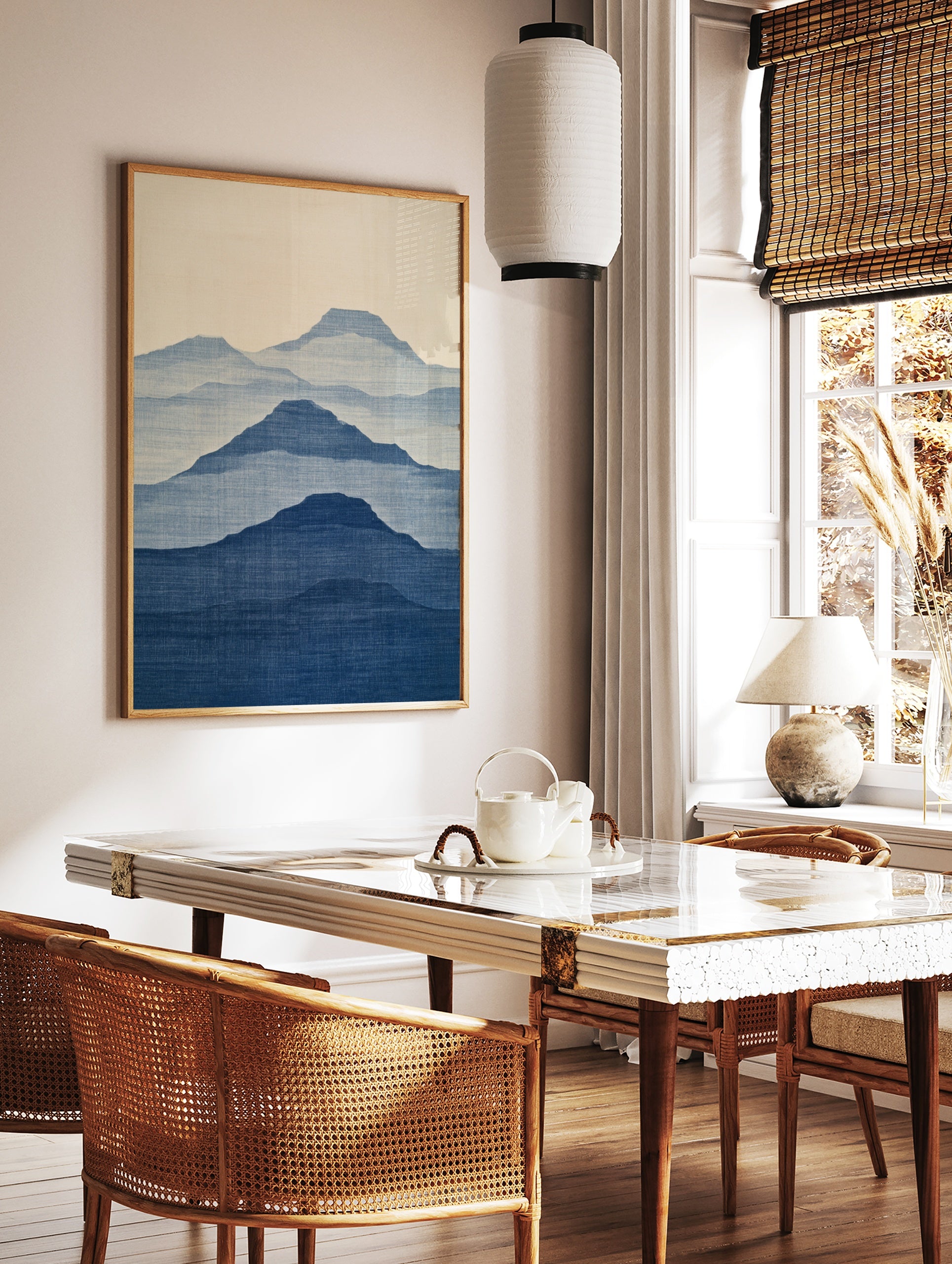 Minimalist mountain landscape wall art with layered blue silhouettes and fabric texture on a light, in a styled room mockup
