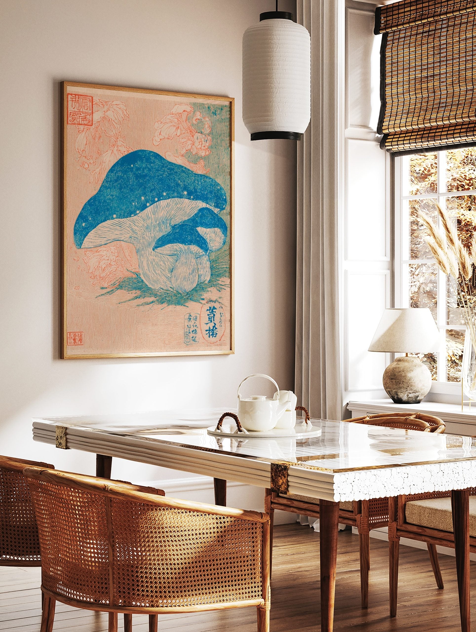 Japanese botanical print of three blue mushrooms with pale gills on green grass, peach background, in a styled room mockup