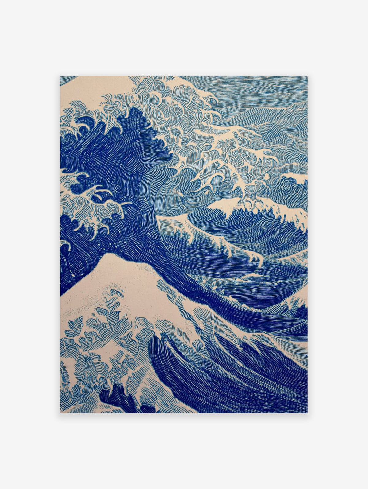 Blue ocean wave art print in a Japanese woodcut style, showing large waves cresting against a light background.