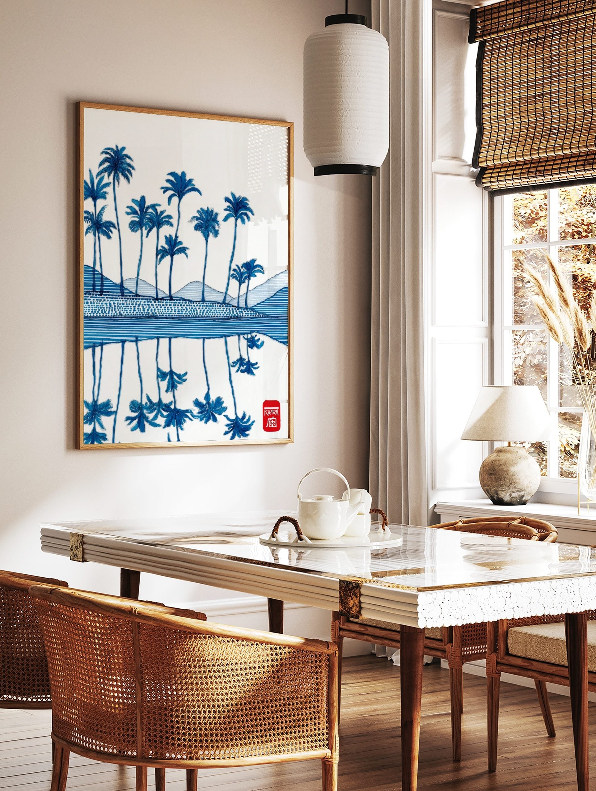 Illustrative blue palm trees and reflections on water, with patterned hills and a red seal, in a styled room mockup
