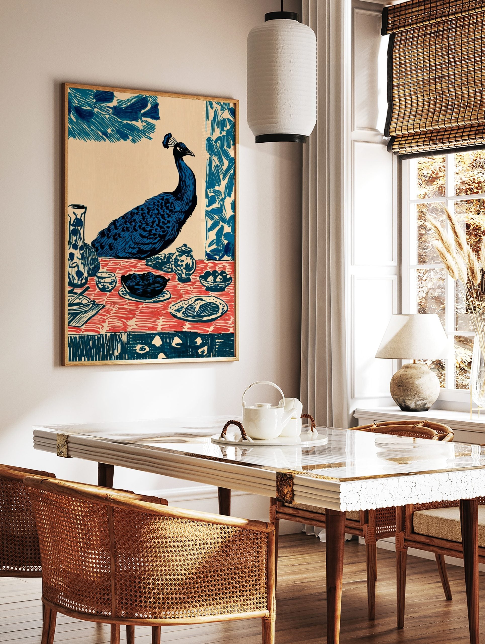 Illustrative blue peacock seated at a dining table with red patterned tablecloth and ceramic dishes, in a styled room mockup