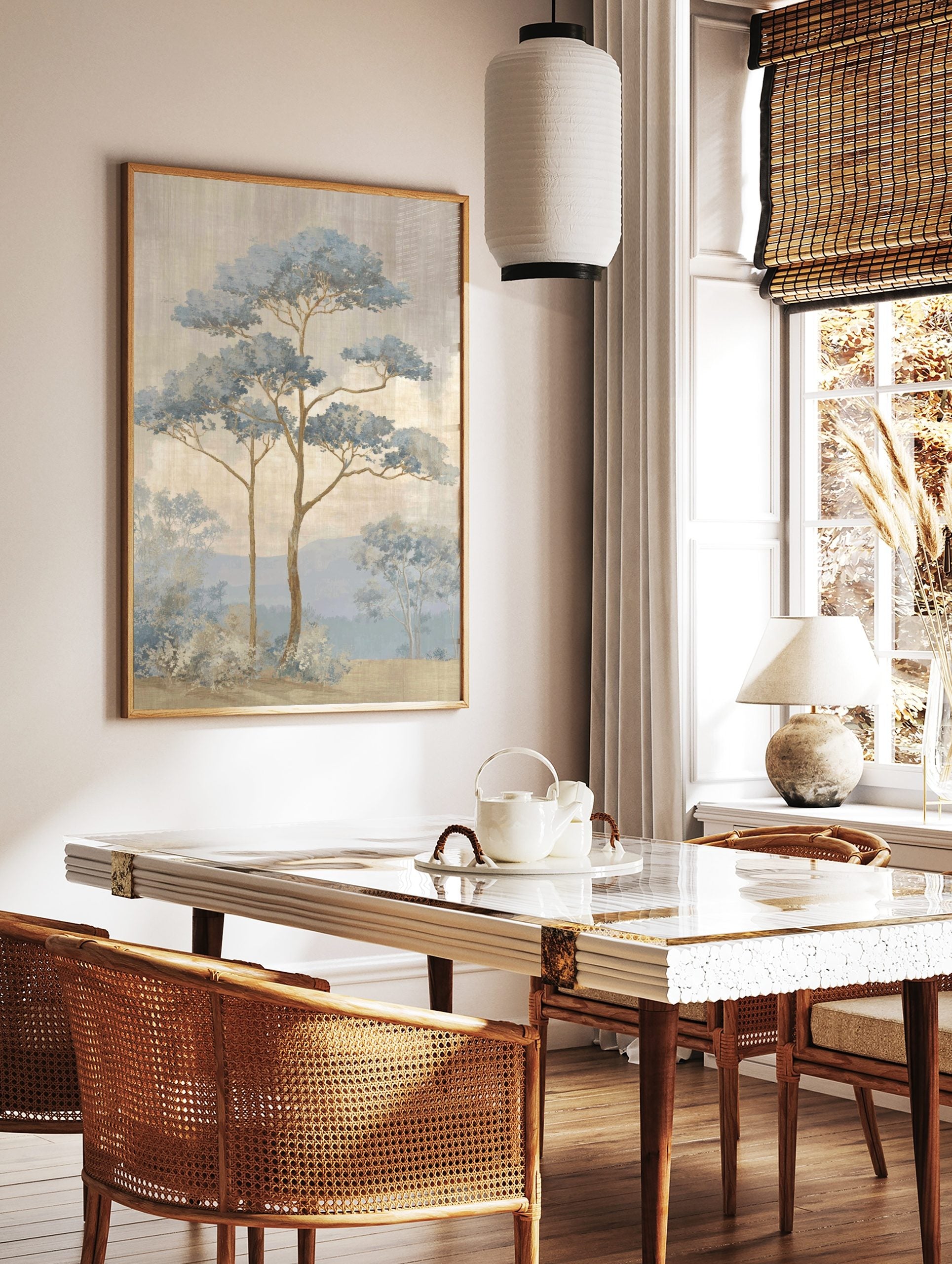 Illustrative blue pine trees in a misty landscape with mountains and textured sky, in a styled room mockup