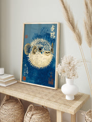 Blue pufferfish art print in Japanese woodblock style, with white spikes and deep blue, in an alternate framed mockup
