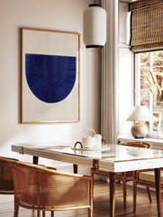 Textured deep blue semi-circle abstract art print with vertical and radiating lines on a light, in a styled room mockup