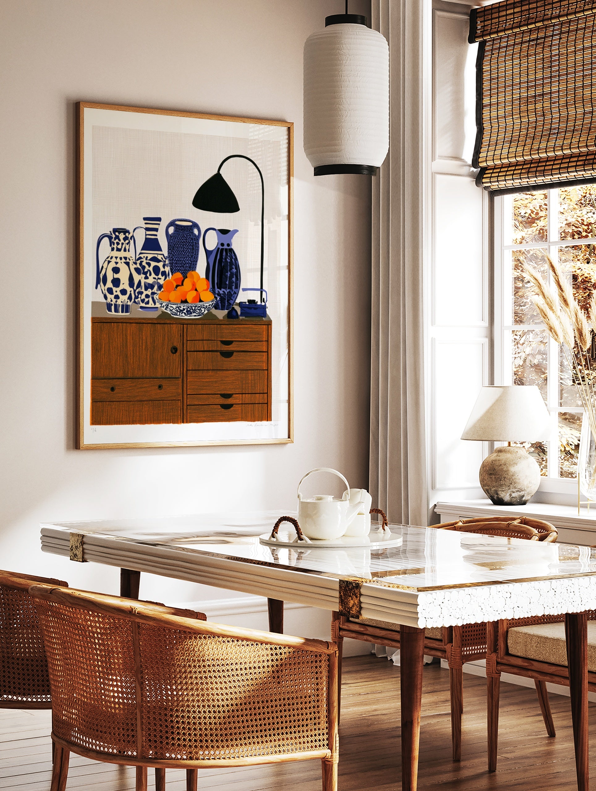 Still life art print featuring four patterned blue and white vases, a bowl of oranges, and a desk, in a styled room mockup