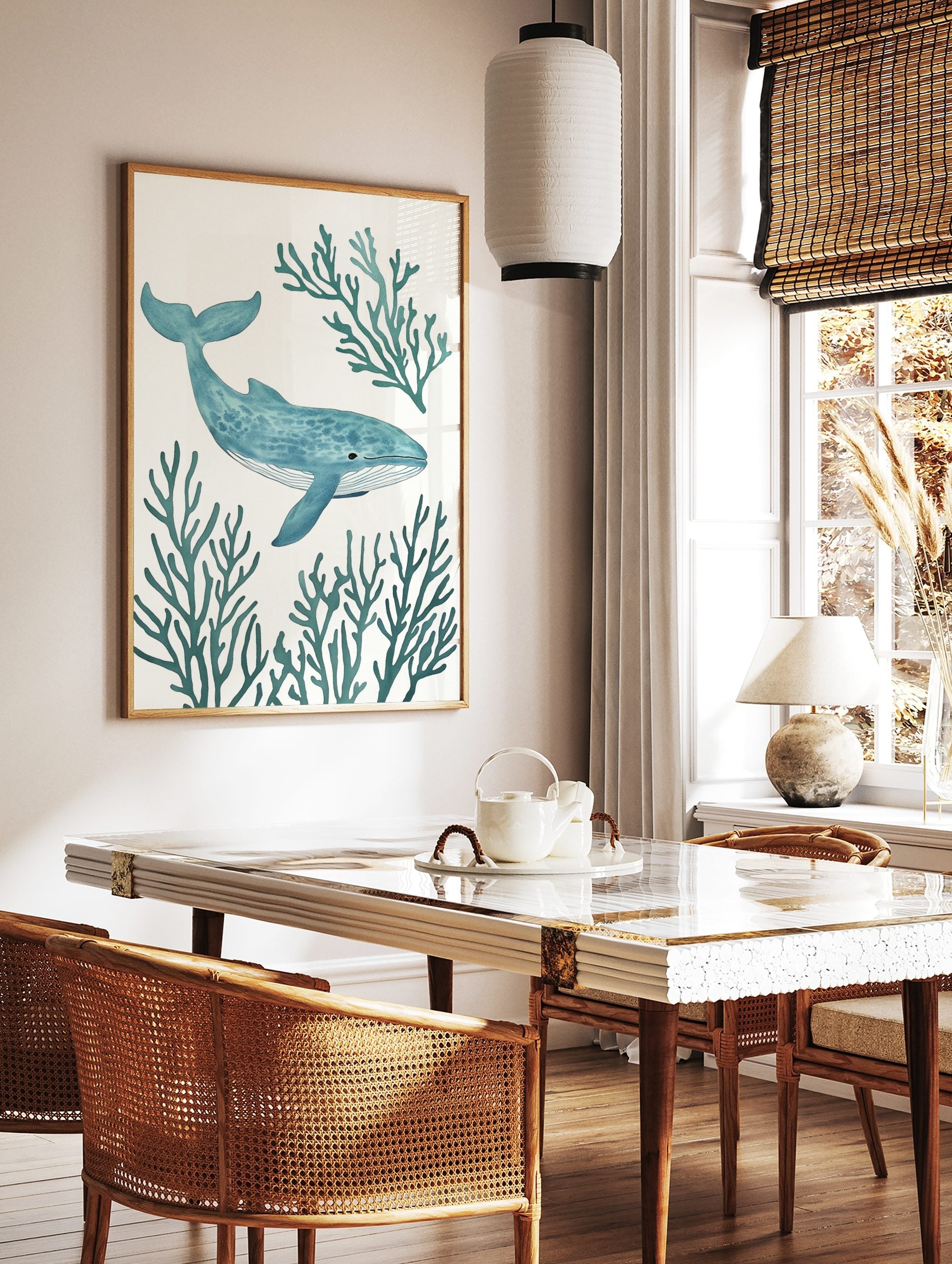 Blue whale with stippled texture swimming amidst teal coral branches on a white background, marine, in a styled room mockup