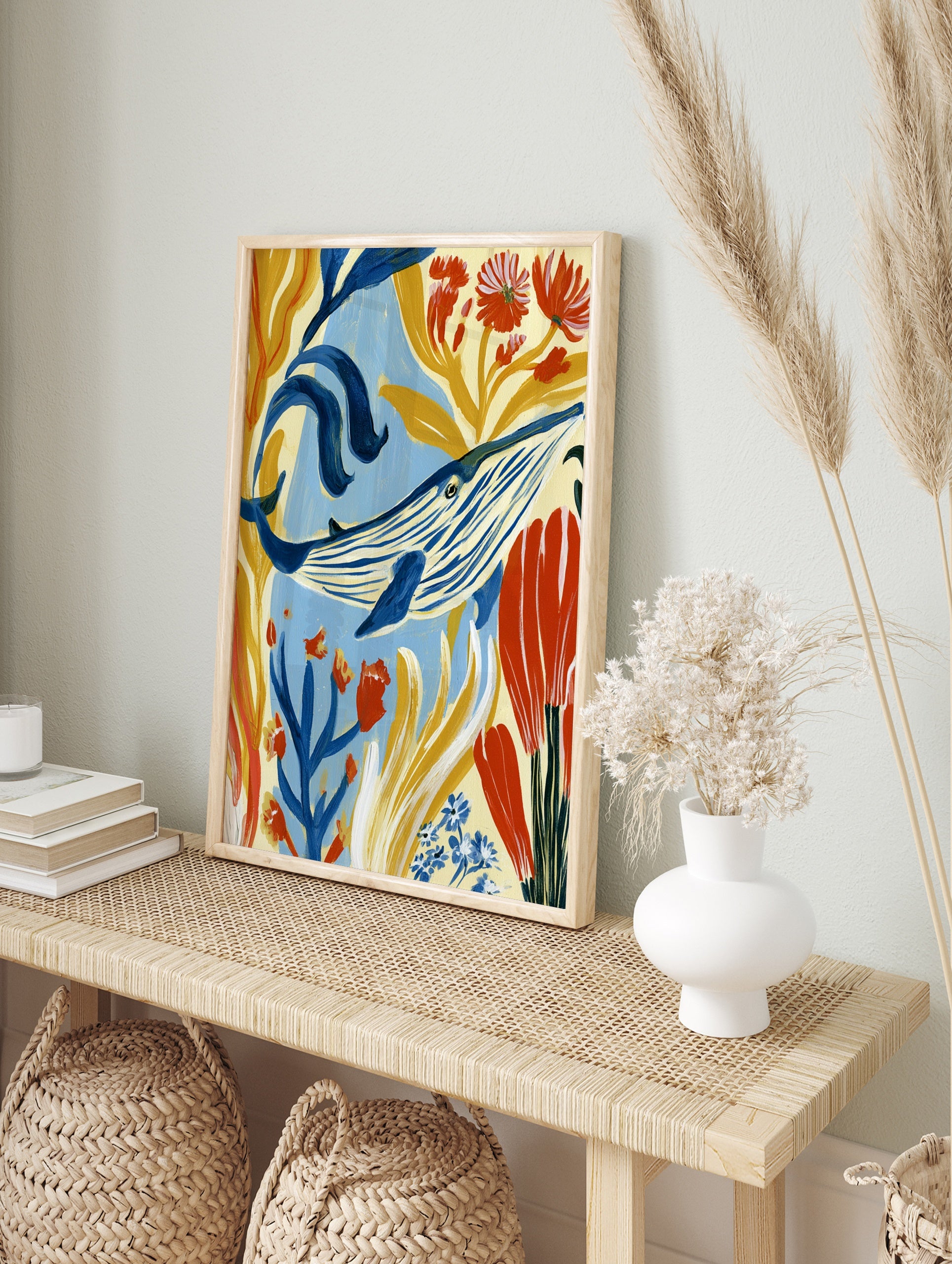 Blue whale illustration with golden seaweed and red flowers, painterly underwater wall art, in an alternate framed mockup