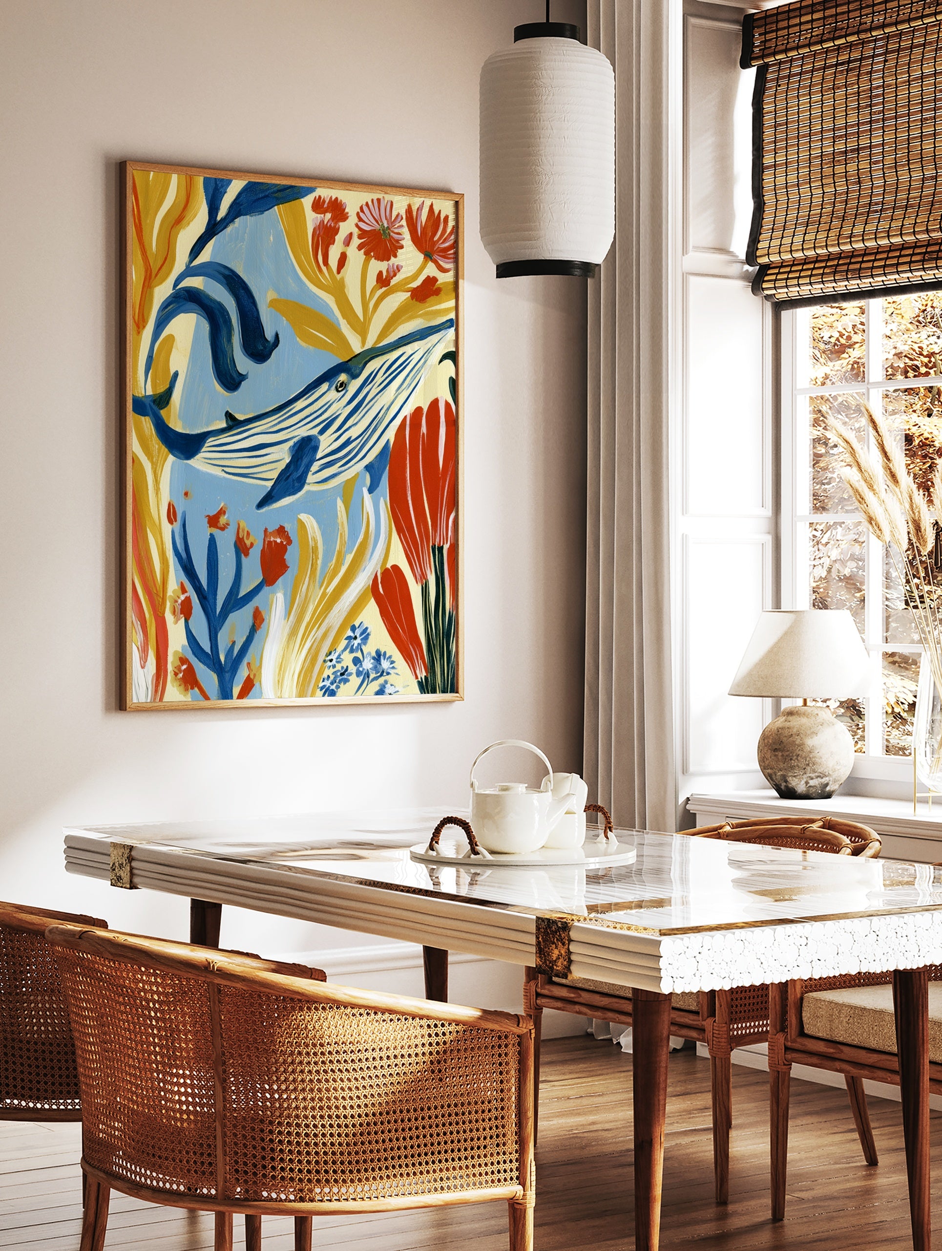 Blue whale illustration with golden seaweed and red flowers, painterly underwater wall art print, in a styled room mockup
