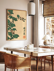 Botanical Japanese woodblock style print featuring orange berries and green leaves on a cream, in a styled room mockup