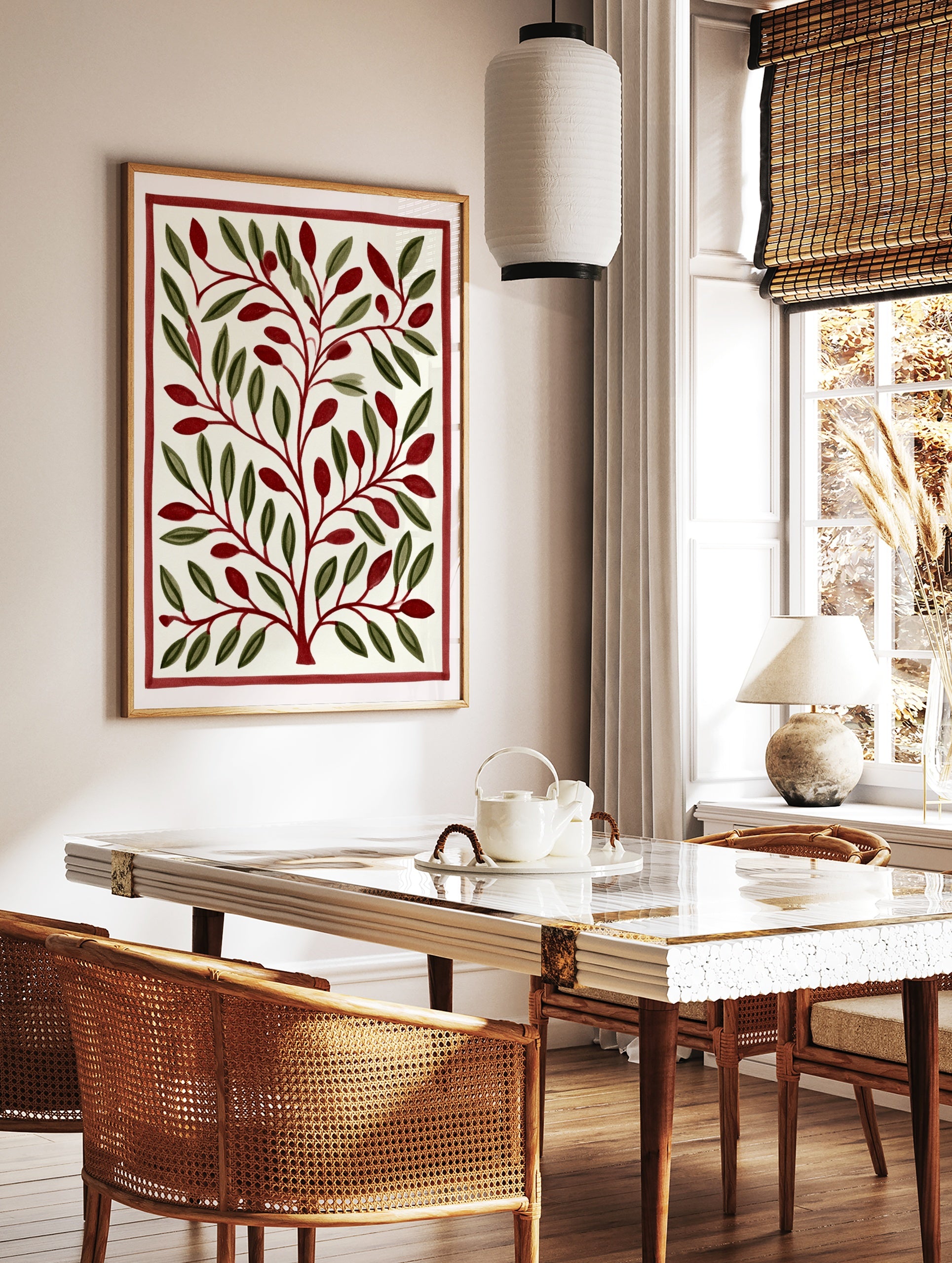 Stylised botanical illustration with green leaves and red berries inside a red border on a cream, in a styled room mockup