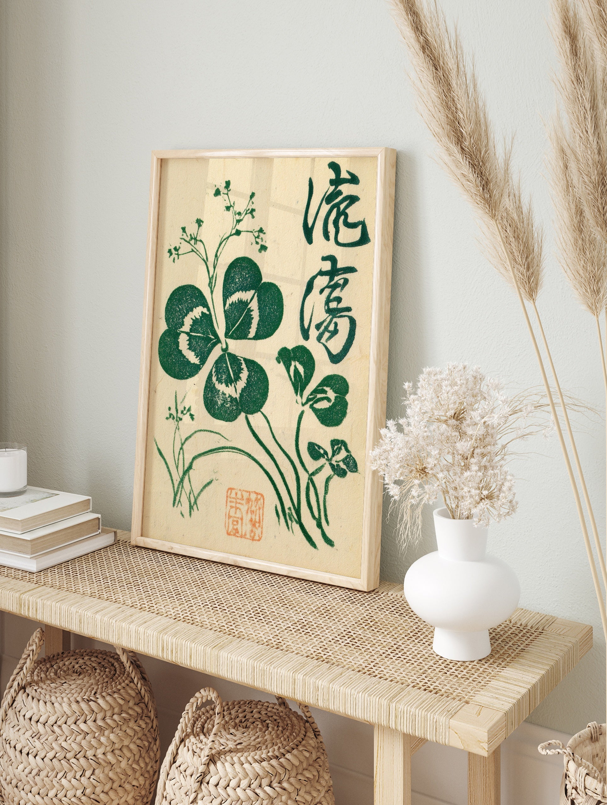 Botanical clover illustration with Japanese calligraphy and red seal on cream background, in an alternate framed mockup