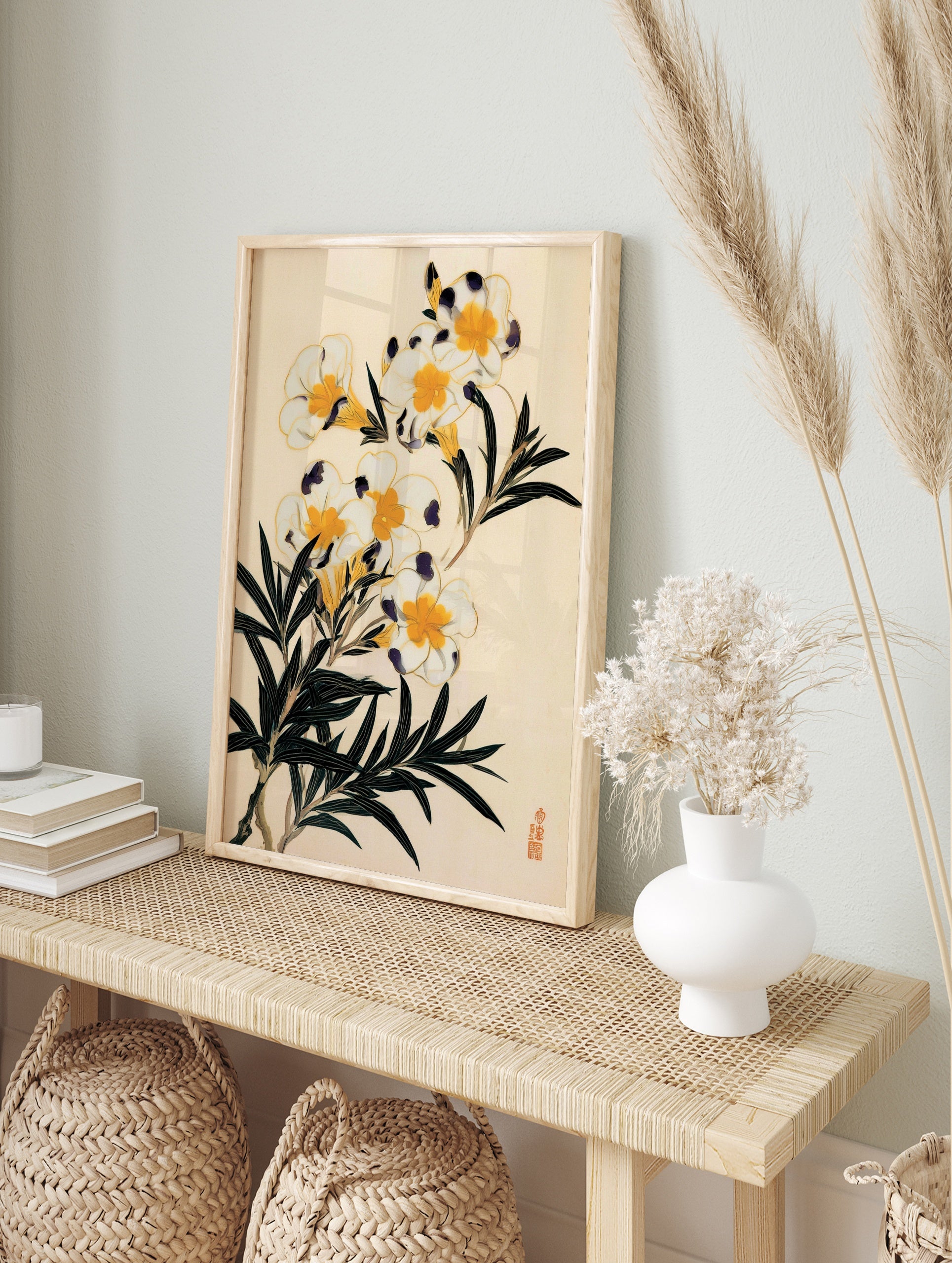 Botanical illustration of white flowers with yellow centres, dark purple accents, and green, in an alternate framed mockup