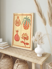 Botanical wall art illustration featuring a pineapple, pomegranate halves, and a flower in, in an alternate framed mockup