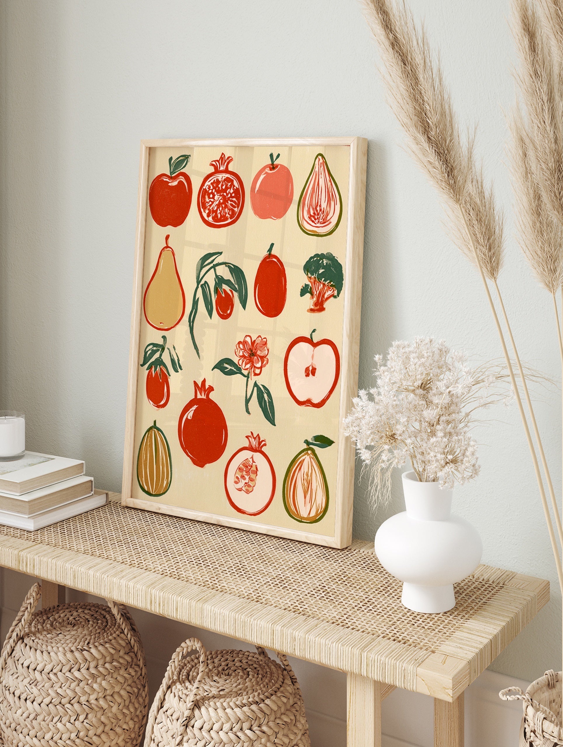 Botanical fruit illustration with red pomegranates, apples, and pears in a retro block-print, in an alternate framed mockup