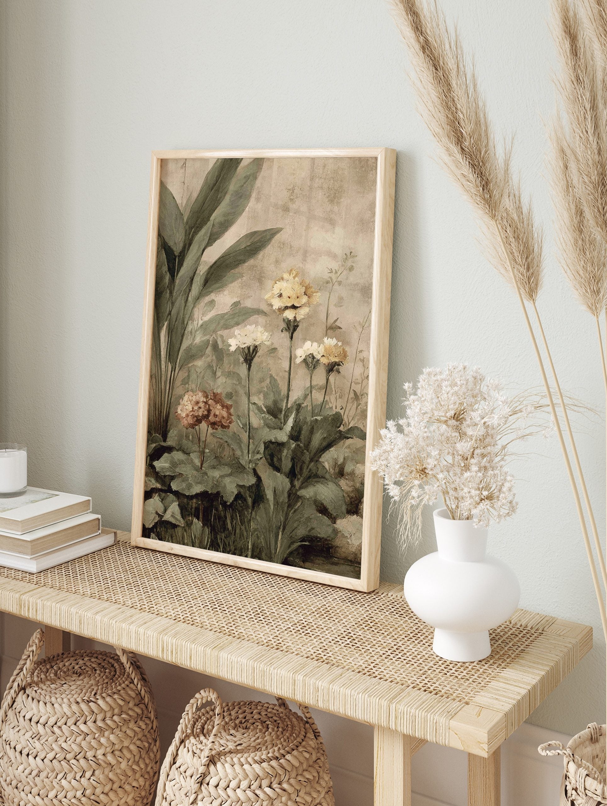 Botanical garden art print with large green leaves, yellow and muted pink flowers, on a, in an alternate framed mockup