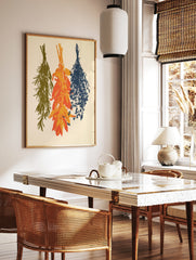 Three bundles of hanging herbs in olive green, orange, and navy blue illustration on an off-white, in a styled room mockup