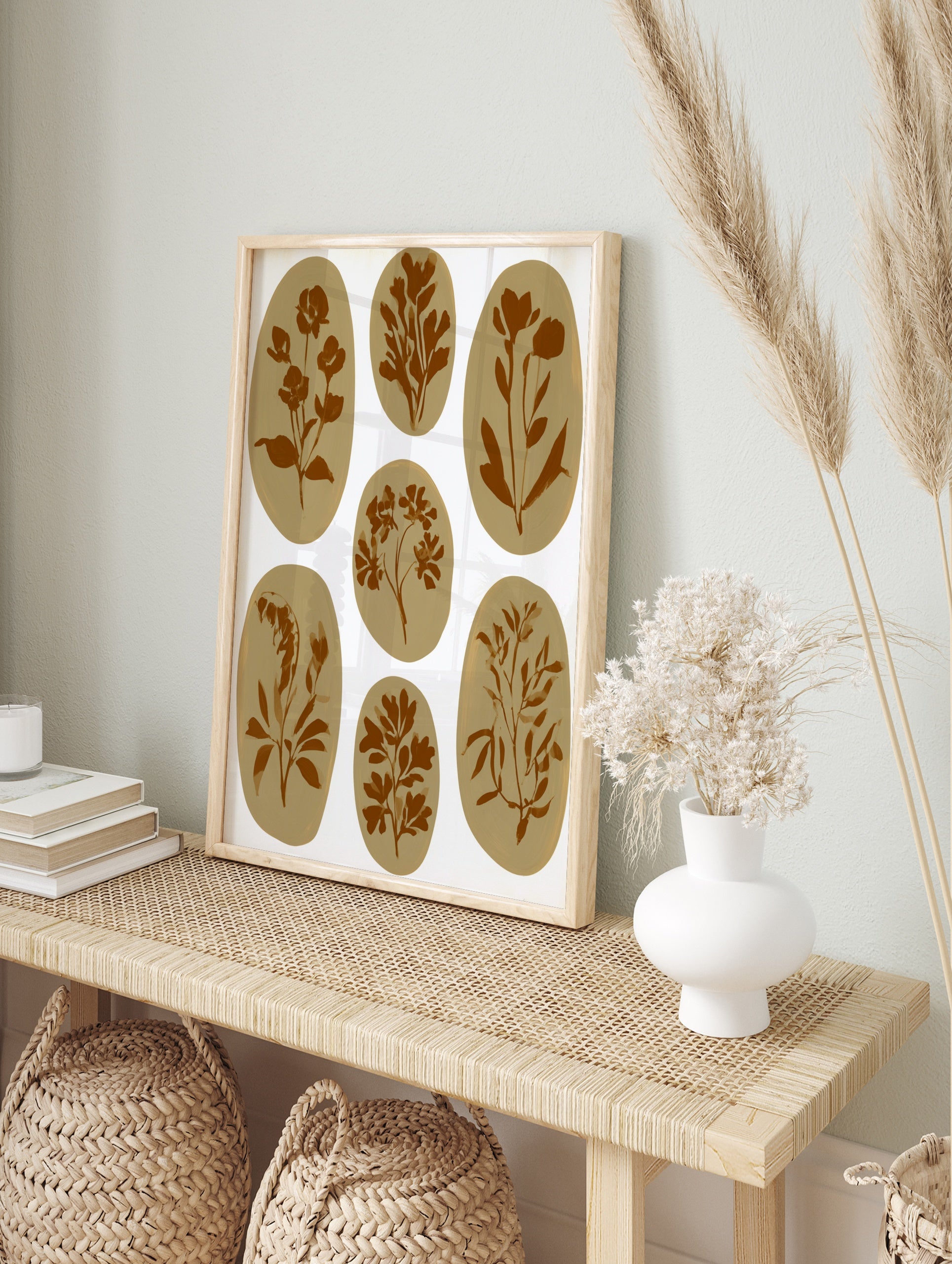 Seven brown botanical illustrations in oval shapes on a white background, in an alternate framed mockup