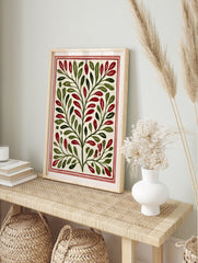 Botanical illustration with symmetrical green leaves and red berries on a cream background, in an alternate framed mockup
