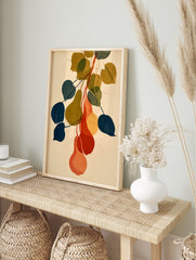Botanical pear wall art illustration with overlapping navy, olive, and orange fruit shapes on, in an alternate framed mockup