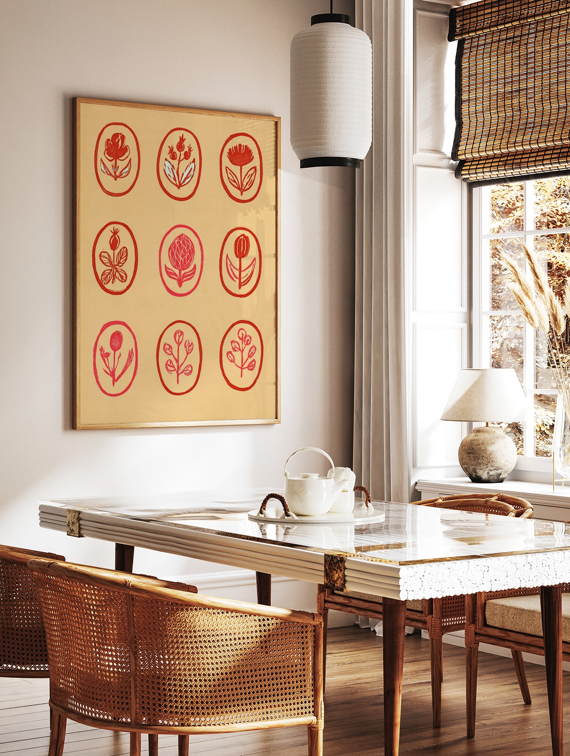 Botanical red flower grid wall art illustration with nine oval frames on a tan background, in a styled room mockup