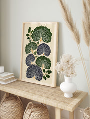 Botanical wall art print with stylized dark green and blue fan-like leaves, white veins, and green branches on a cream background. - Image 3