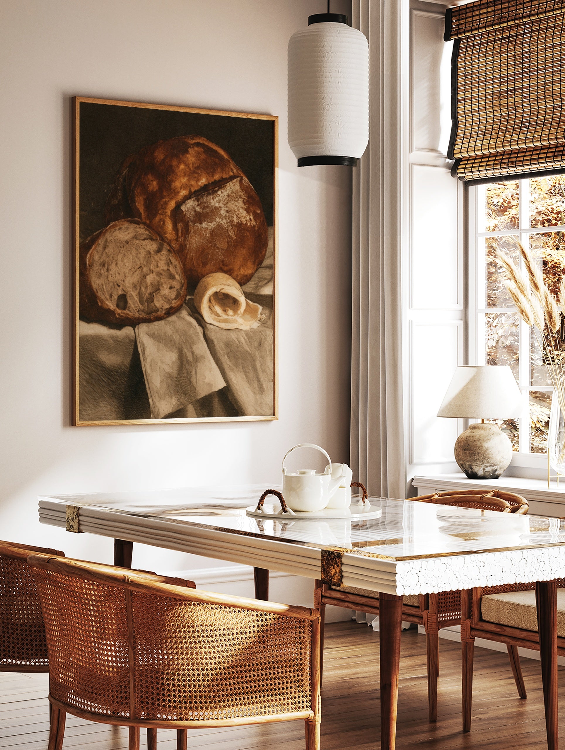 Still life wall art print of a crusty loaf of bread, a slice, and a curl of butter on draped fabric, in a styled room mockup