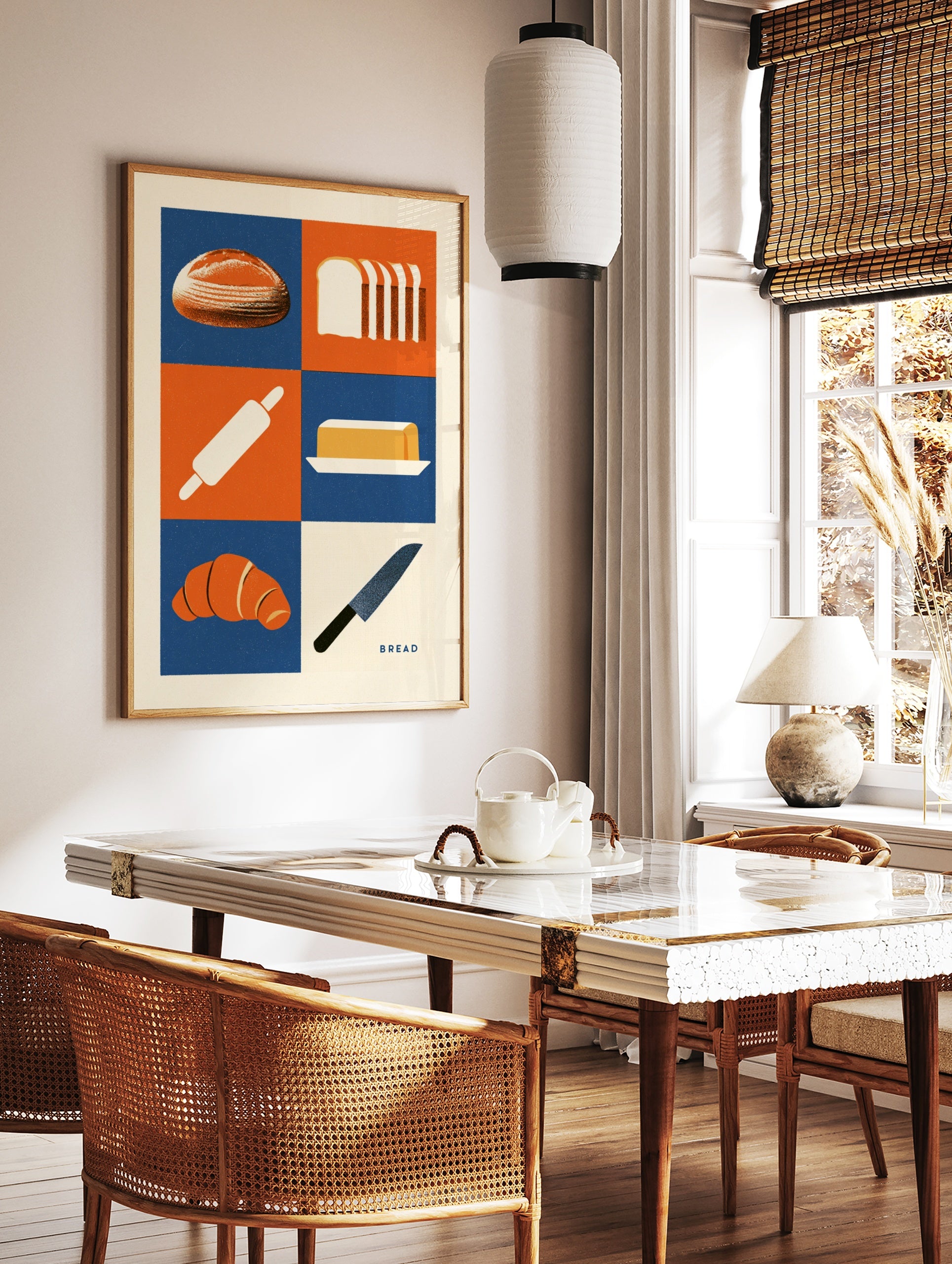 Bakery themed wall art print with bread, croissant, butter, and kitchen tools in a blue and orange, in a styled room mockup