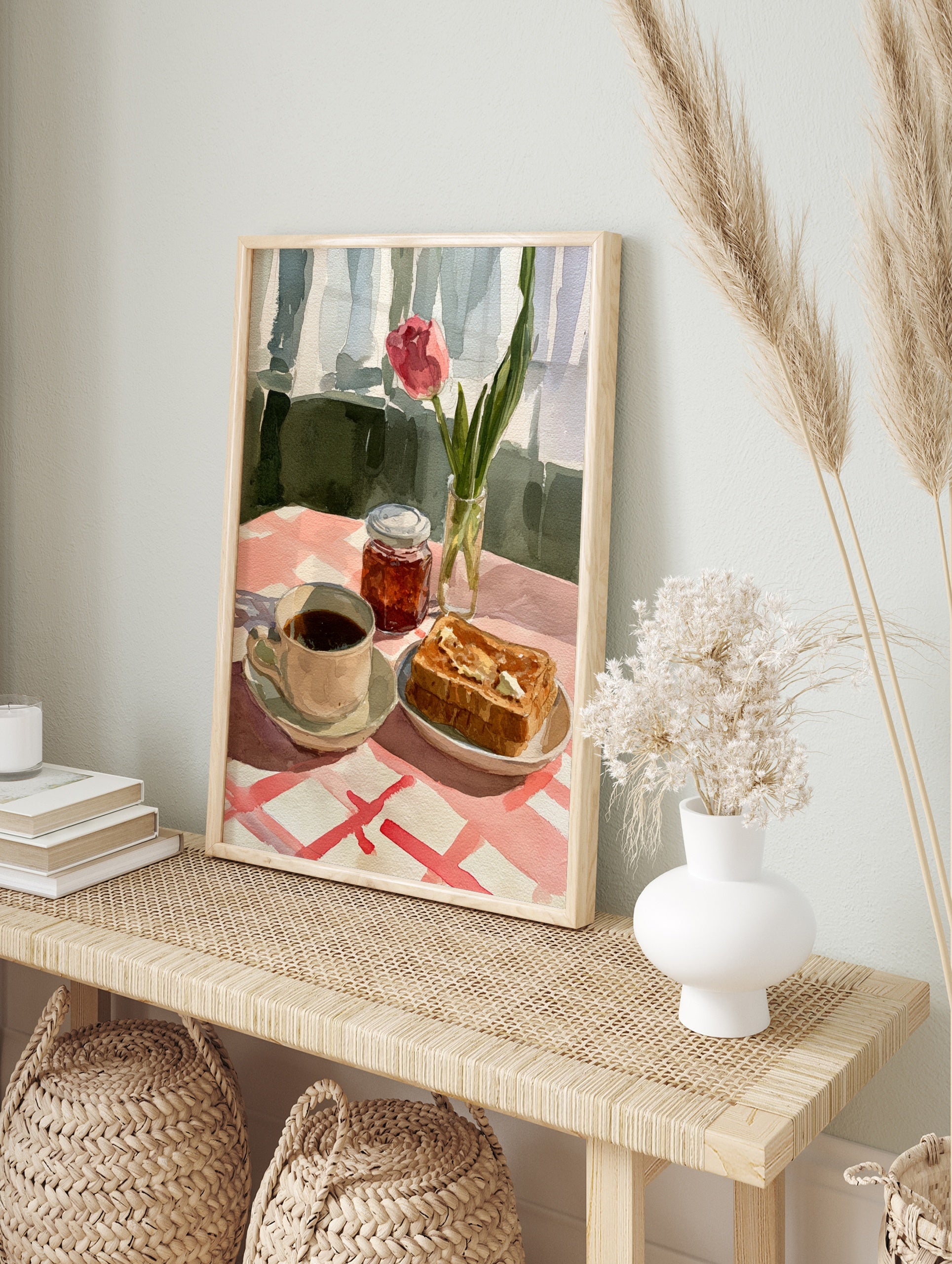 Watercolour illustration of a pink tulip, coffee, and buttered toast on a red and white, in an alternate framed mockup