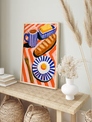 Breakfast still life illustration with baguette, fried egg, and coffee on a striped orange, in an alternate framed mockup