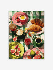Vibrant breakfast wall art illustration with croissants, figs, coffee, egg, and jam on a green checkered tablecloth.