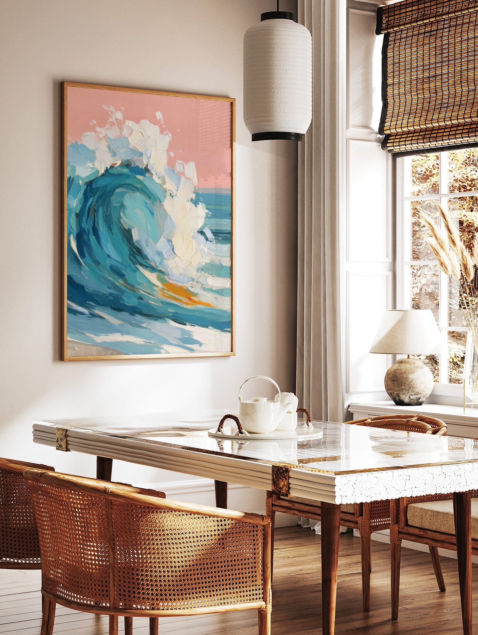Textured impasto painting of a large breaking ocean wave with blue water, white foam, and a pink sky, in a styled room mockup