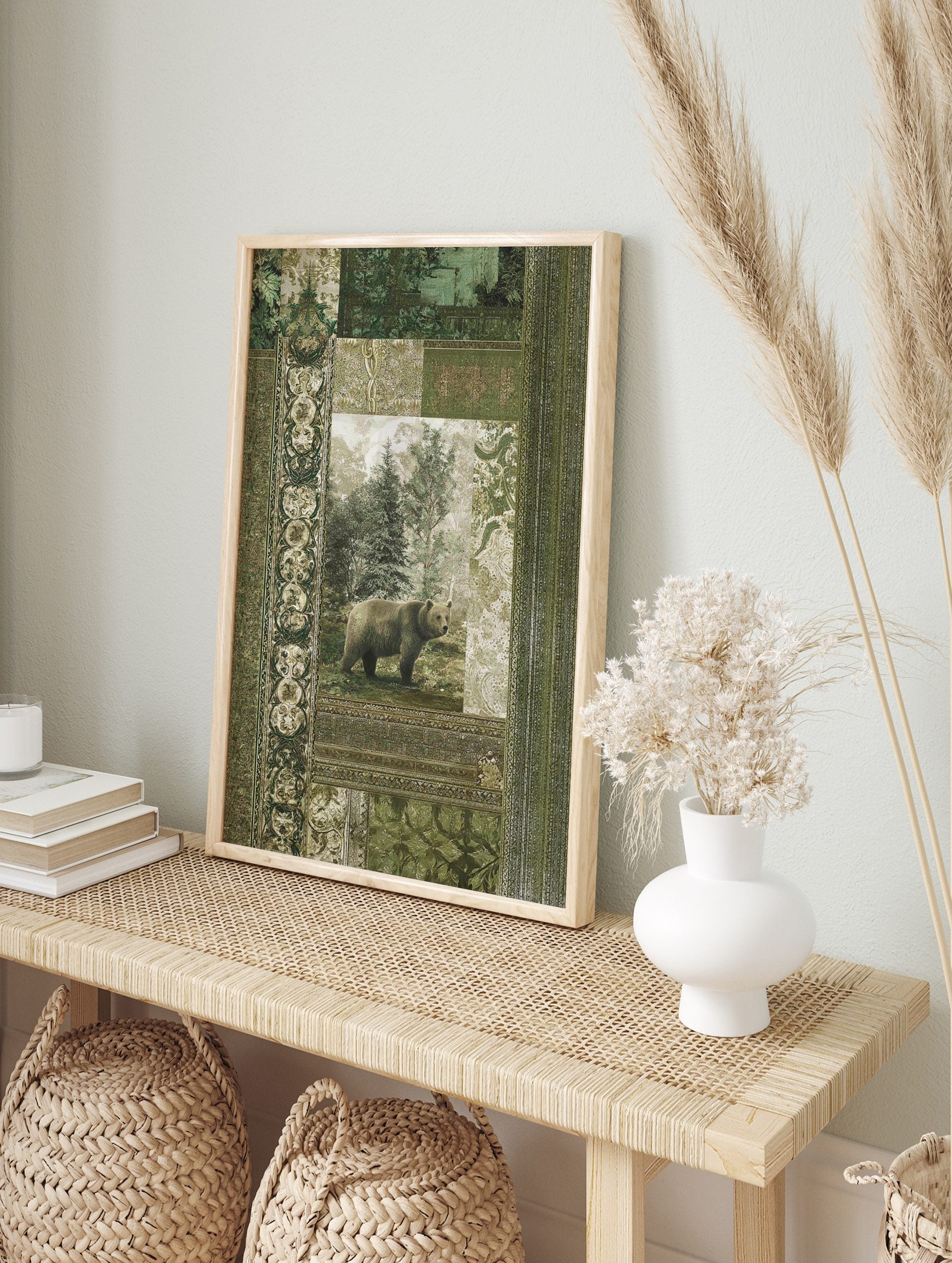 Brown bear standing in a misty forest, surrounded by ornate green and beige botanical, in an alternate framed mockup