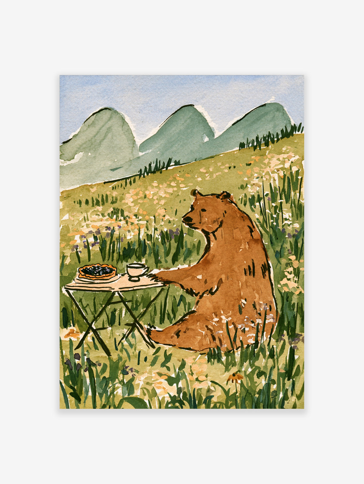 Brown bear sitting at a folding table with a berry pie and cup in a flower meadow, green mountains behind