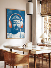Buddha head illustration wearing large orange headphones on a textured blue background, pop art, in a styled room mockup