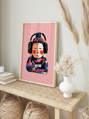 Painterly illustration of a Buddha figure wearing black headphones against a solid pink, in an alternate framed mockup