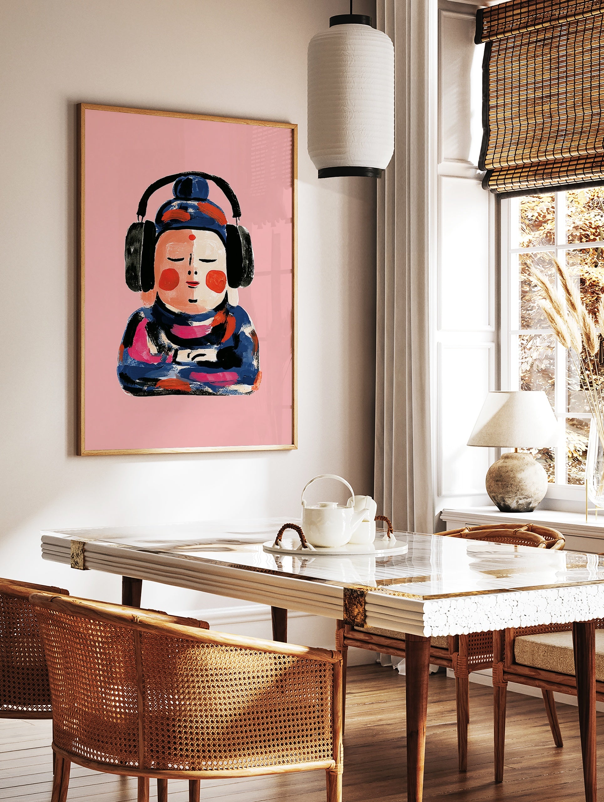 Painterly illustration of a Buddha figure wearing black headphones against a solid pink background, in a styled room mockup