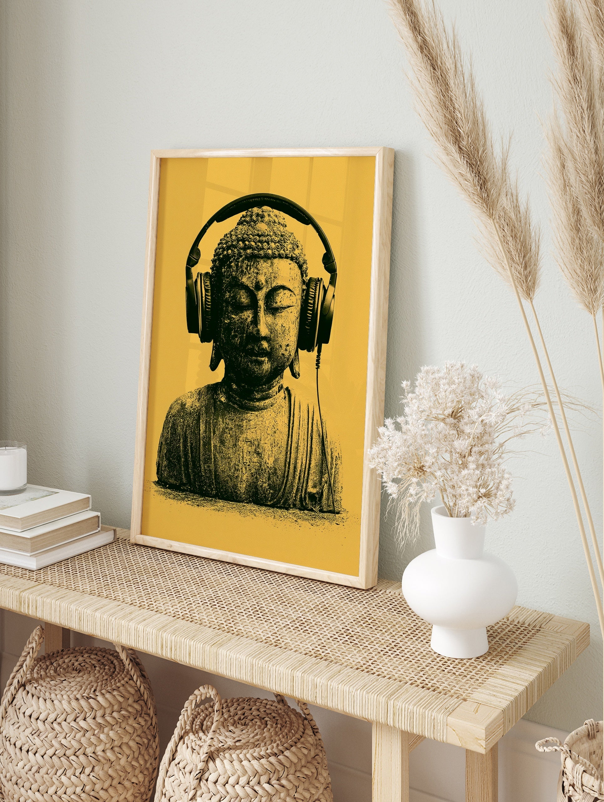 Buddha statue wearing over-ear headphones against a yellow background, modern graphic wall, in an alternate framed mockup