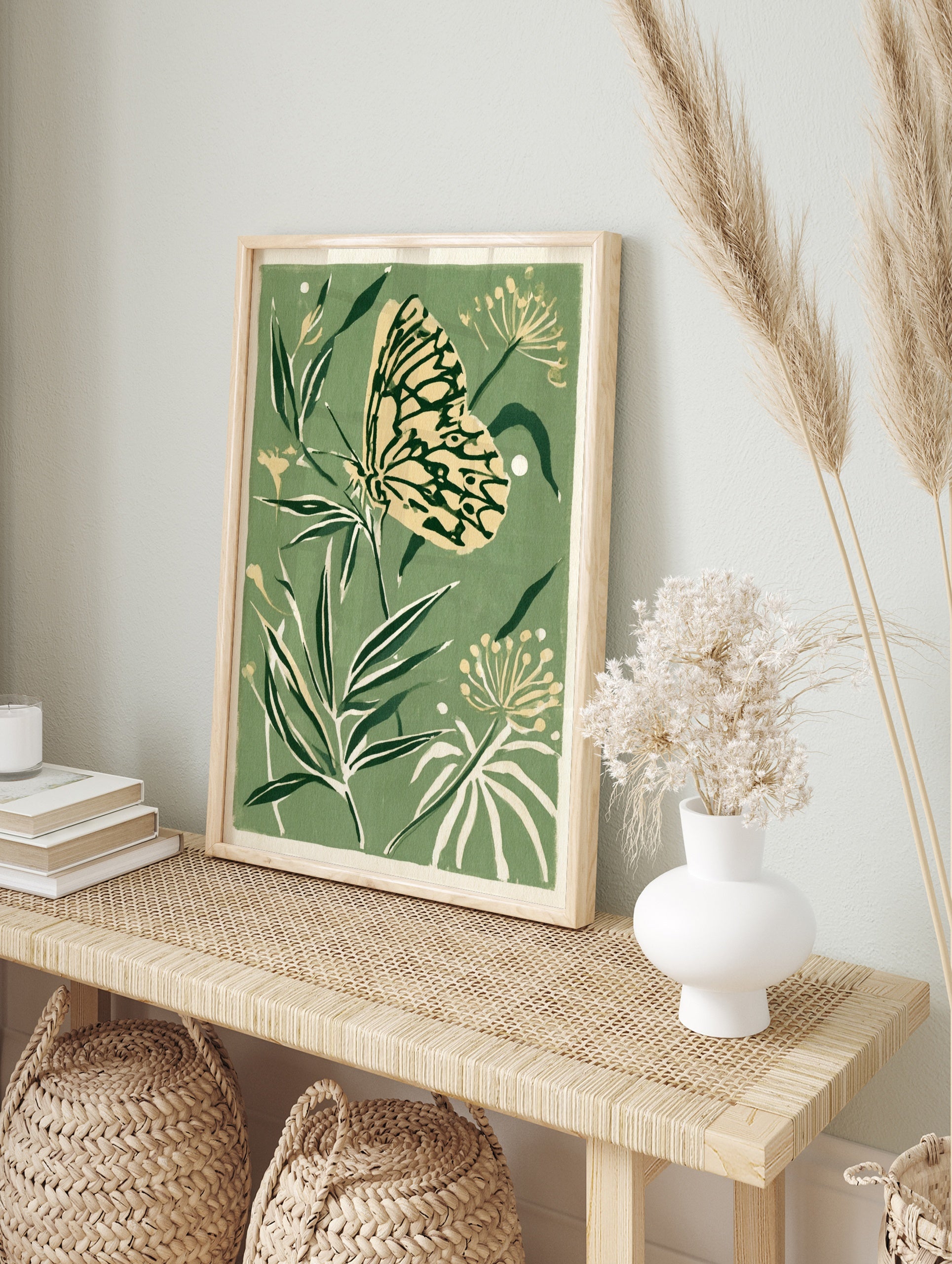 Butterfly and botanical foliage illustration in sage green and cream colours as a botanical, in an alternate framed mockup